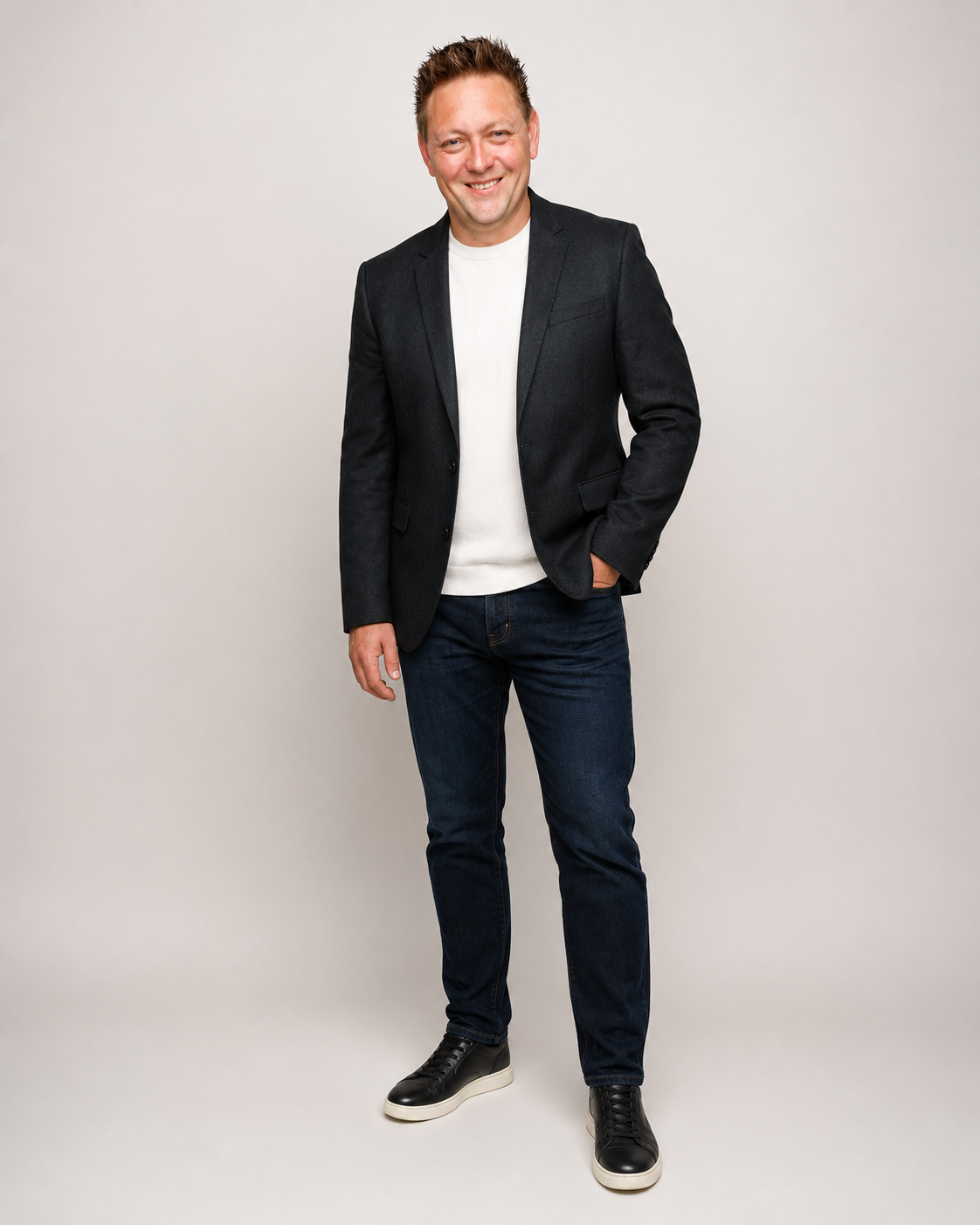 Nathan Graham, AI strategist and author, standing in a white shirt
